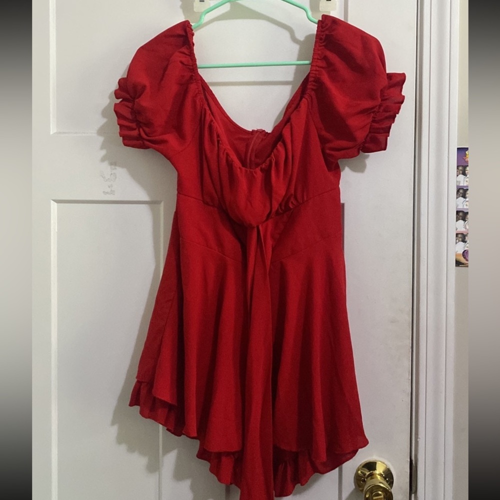 Red Dress styled romper. Has shorts underneath. 

Never worn.